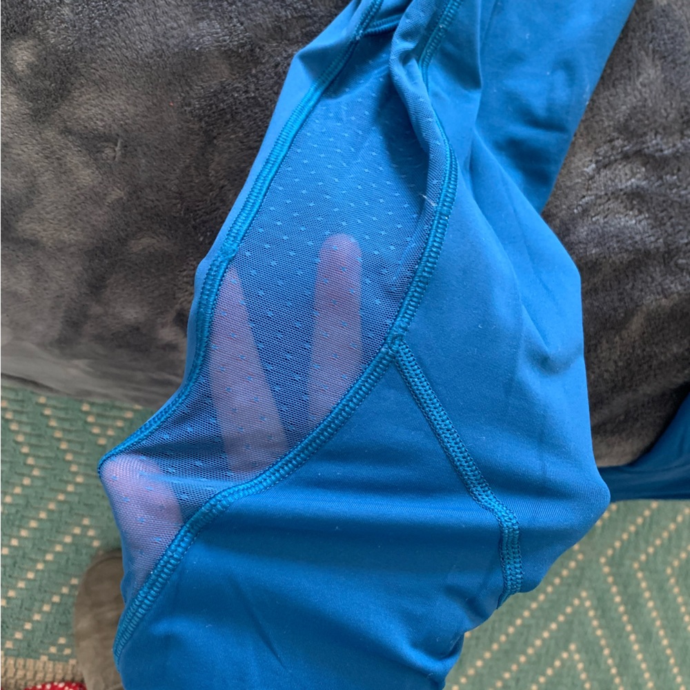 Lululemon size 8 blue leggings with polka dot mesh sides. lightly worn